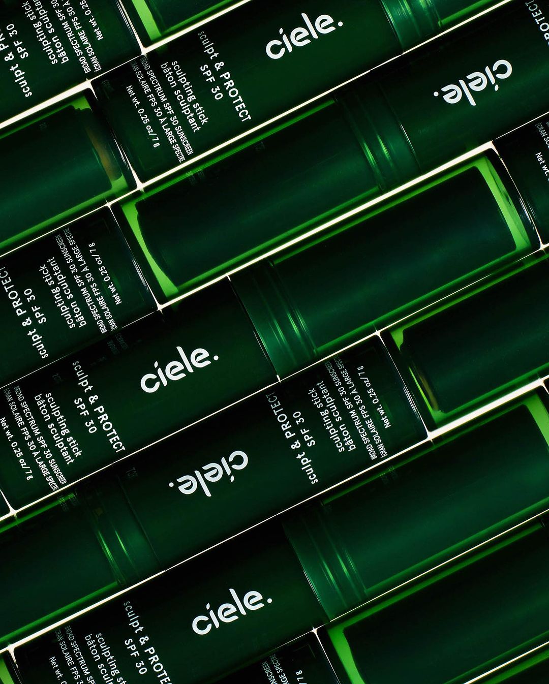 Multiple green sunscreen sticks with 'ciele.' logo and 'Sculpt & Protect SPF 30' arranged in a neat, slightly angled, eye-level product shot.
