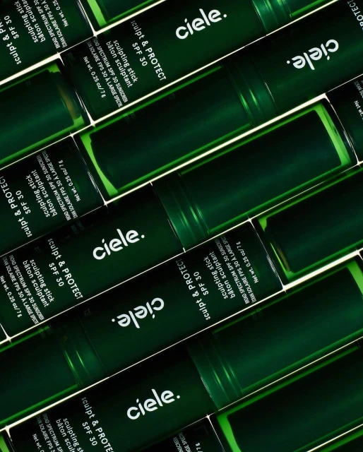 Multiple green sunscreen sticks with 'ciele.' logo and 'Sculpt & Protect SPF 30' arranged in a neat, slightly angled, eye-level product shot.