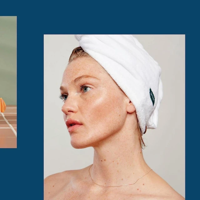 Close-up shot of a woman with a white towel wrapped around her head, showcasing a fresh, clean beauty aesthetic and soft, natural lighting.