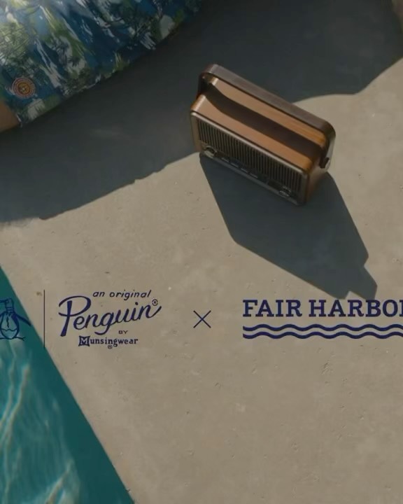 Vintage-style radio sits poolside next to Fair Harbor and Original Penguin brand logos on a sunny day, evoking summer vibes.