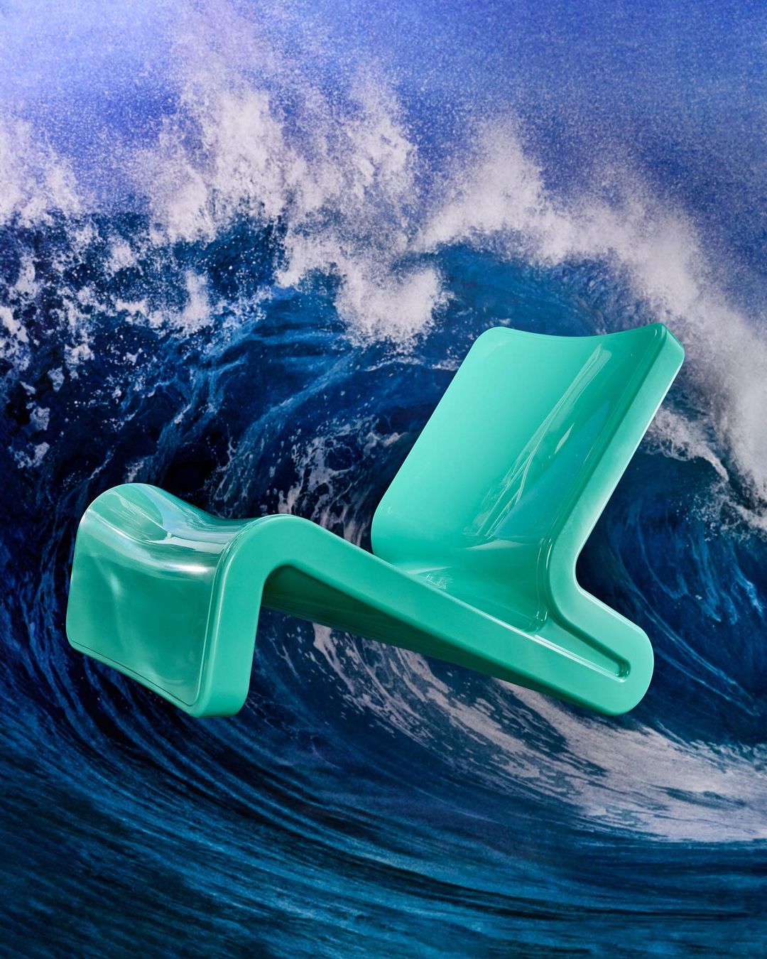 Modern teal lounge chair is showcased against a dynamic backdrop of a large ocean wave with striking visual contrast and fluid movement.