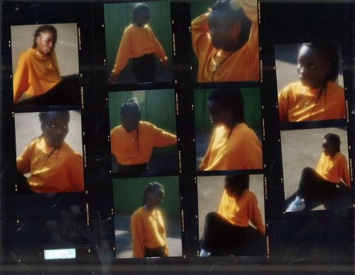 Contact sheet with a young Black woman in an orange sweater, posing in nine different frames, creating a vintage, film-like aesthetic.