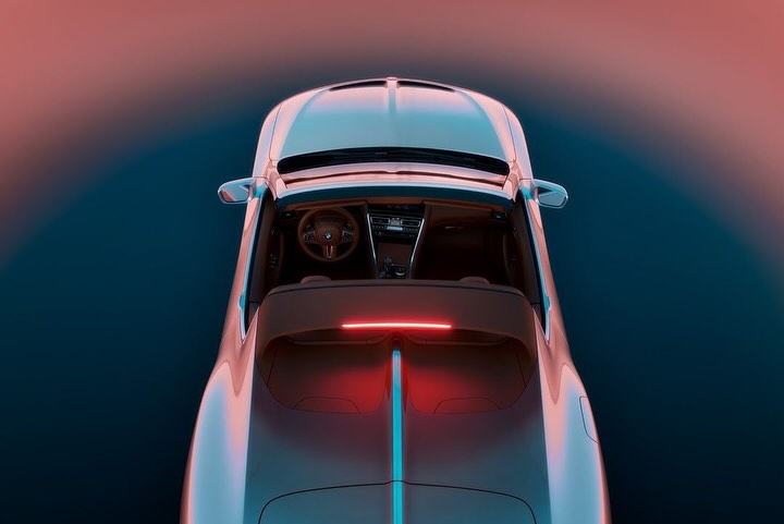 Top-down overhead view of a luxury convertible sports car with glowing red accent lighting and tan interior against a gradient background.