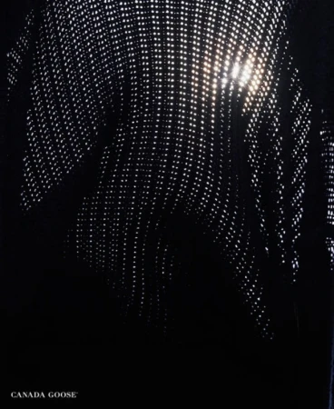 Close-up of black perforated fabric creating bright light dots, styled by Soraya Dayani in Los Angeles.