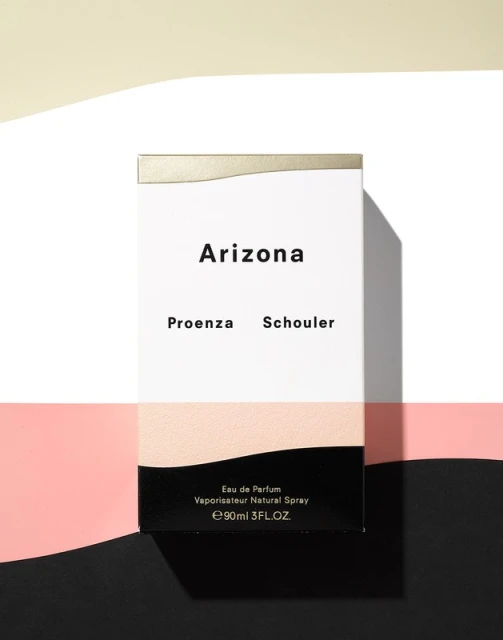 Arizona Proenza Schouler Eau de Parfum box in a studio setting with multiple backgrounds of cream, pink, and black.