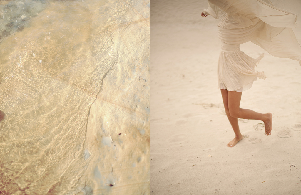 Close-up split view of shallow rippling water over sand and a person walking barefoot in a light dress on a sandy beach.