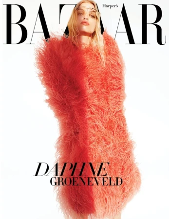 Fashion editorial cover for Harper's Bazaar magazine featuring Daphne Groeneveld wearing a coral shaggy coat on a white backdrop.