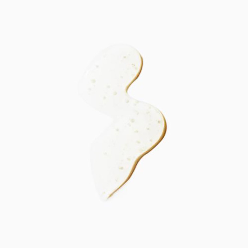 Close-up of a curved line of translucent liquid with small air bubbles on a white background, highlighting its texture and form.