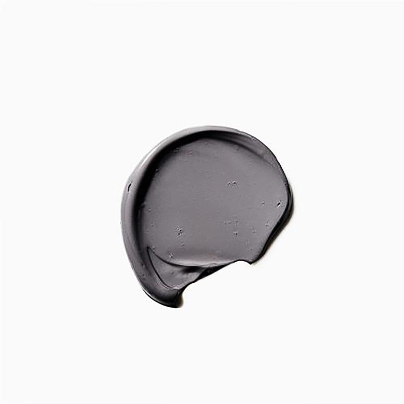 Swirl of gray, creamy cosmetic or skincare product on white background. Minimal beauty shot for product presentation.