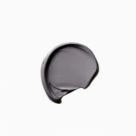 Swirl of gray, creamy cosmetic or skincare product on white background. Minimal beauty shot for product presentation.