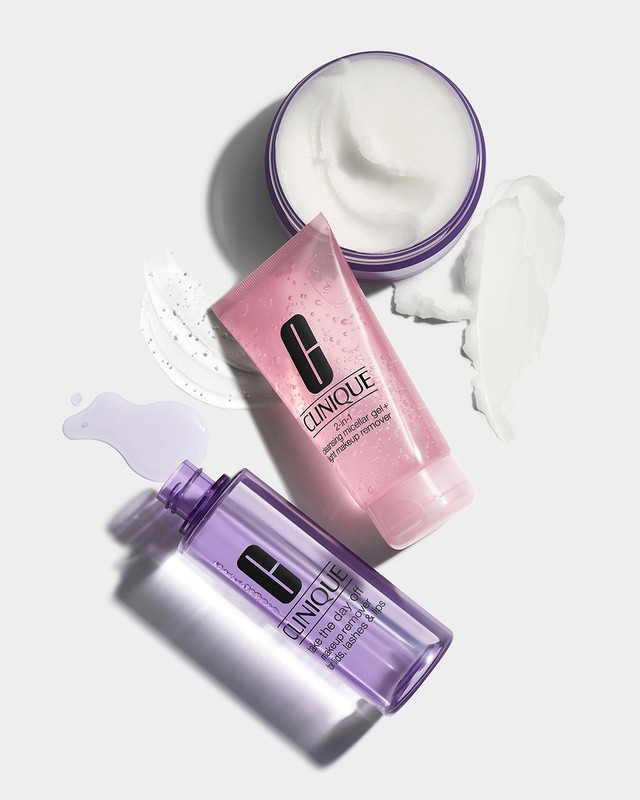 Clinique skincare products: a jar of moisturizer, a tube of gel cleanser, and a bottle of makeup remover on a white background.