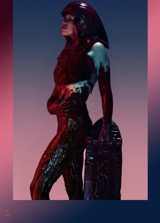 Woman in futuristic costume with headpiece and full body paint leaning on an ornate stone slab in a studio with dramatic lighting.