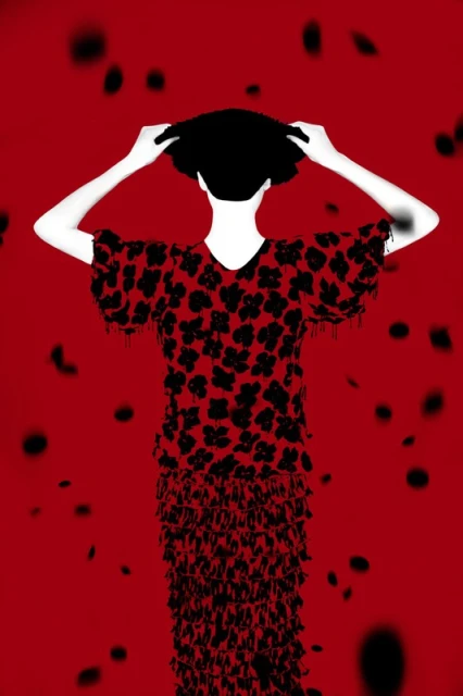 Back view of a person in a red and black floral dress with fringe, raising a black hat in a studio against a red background.