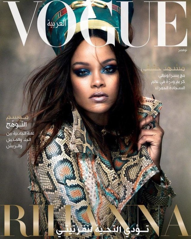 Vogue Arabia magazine cover featuring Rihanna wearing a snakeskin jacket and turquoise headpiece, with heavy blue makeup and dramatic pose.