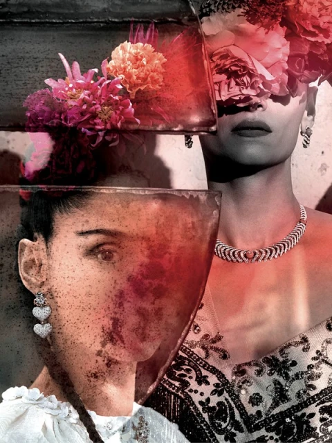 Two women with flowers, jewelry, and embellished clothing are seen in a double exposure artistic shot. One woman's face is obscured.