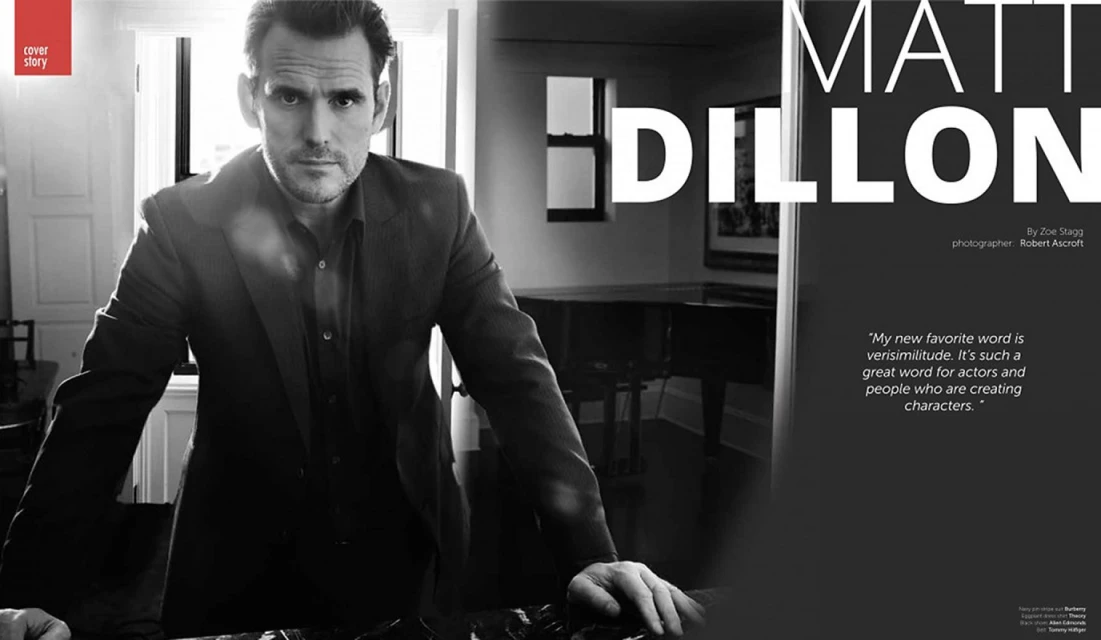 Matt Dillon in a black and white portrait, captured indoors with natural light, creating a dramatic, editorial aesthetic. 