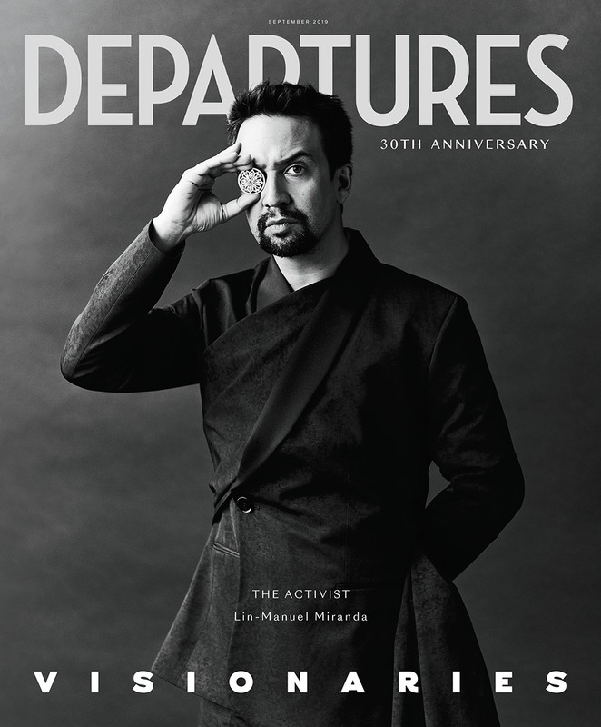 Magazine cover featuring Lin-Manuel Miranda in a black and white portrait, holding a decorative medallion to his eye.