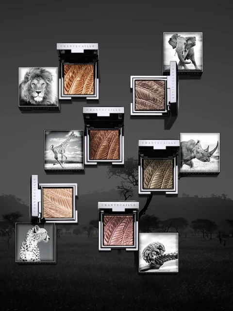 Chantecaille makeup compacts featuring animal images, placed against a muted backdrop suggesting the African savanna.