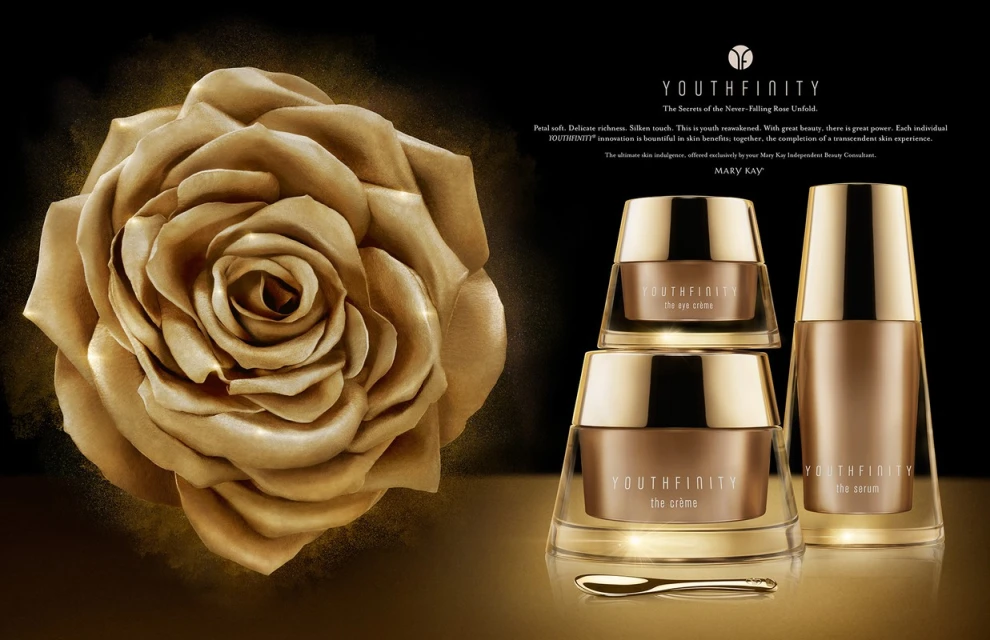 Luxurious skincare product advertisement featuring a golden rose next to a collection of Youthfinity creams and serums by Mary Kay.