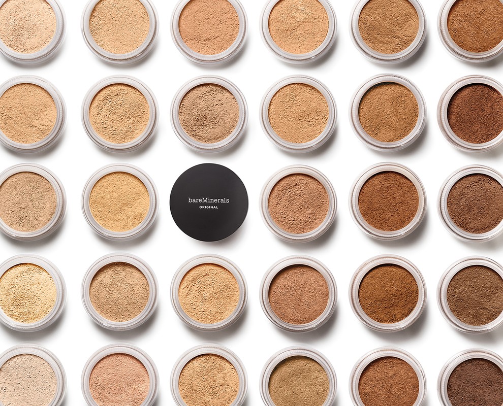 Assortment of BareMinerals Original foundation in various shades arranged on a clean white background, showcasing a diverse range of skin tones.