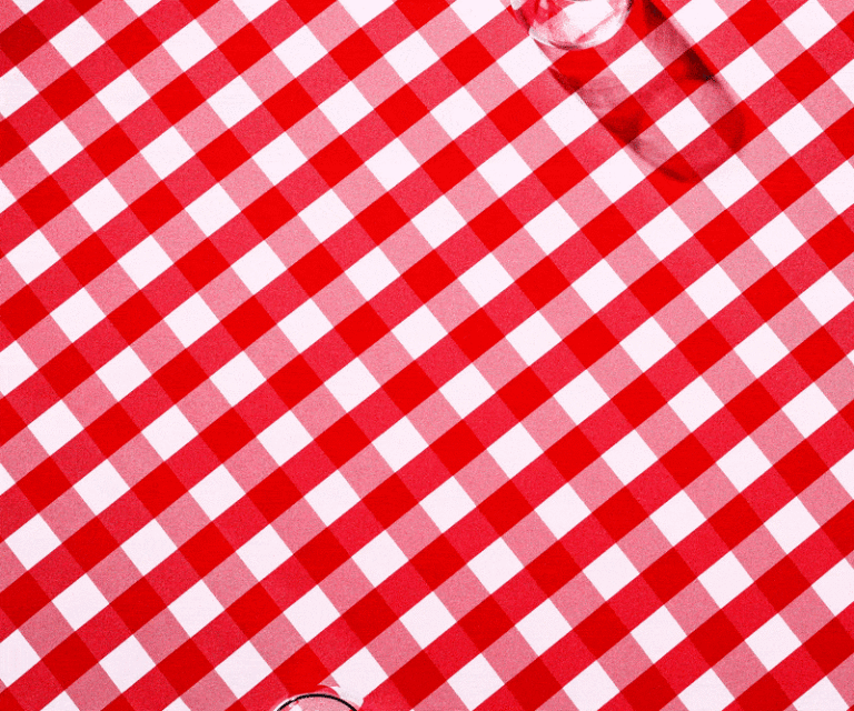 Red and white checkered tablecloth pattern dominates the frame. A blurred glass object is visible in the corner, adding a subtle accent.