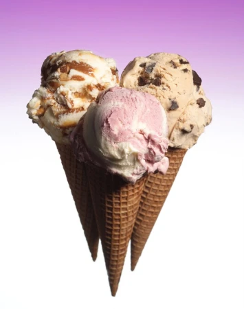 Three ice cream cones with different flavors - caramel nut, chocolate chip, and strawberry - against a purple gradient background.