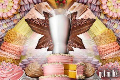 A tall glass of milk centered over layered pink cakes surrounded by symmetrical patterns of cupcakes and pastries.
