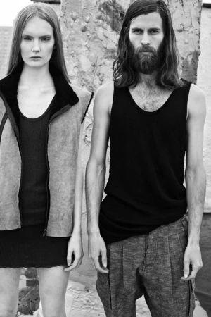 Monochrome fashion portrait featuring a female model and a bearded male model outdoors in New York.