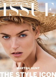 Close-up portrait of a woman wearing a straw hat outdoors with natural light
