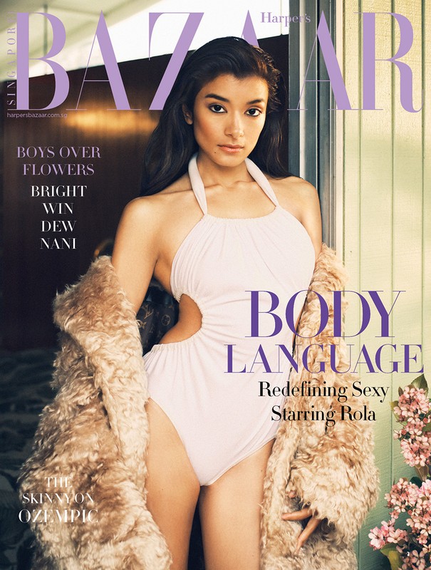 Editorial fashion magazine cover featuring a woman in a swimsuit with a fur coat, set against a backdrop of floral accents and magazine text.