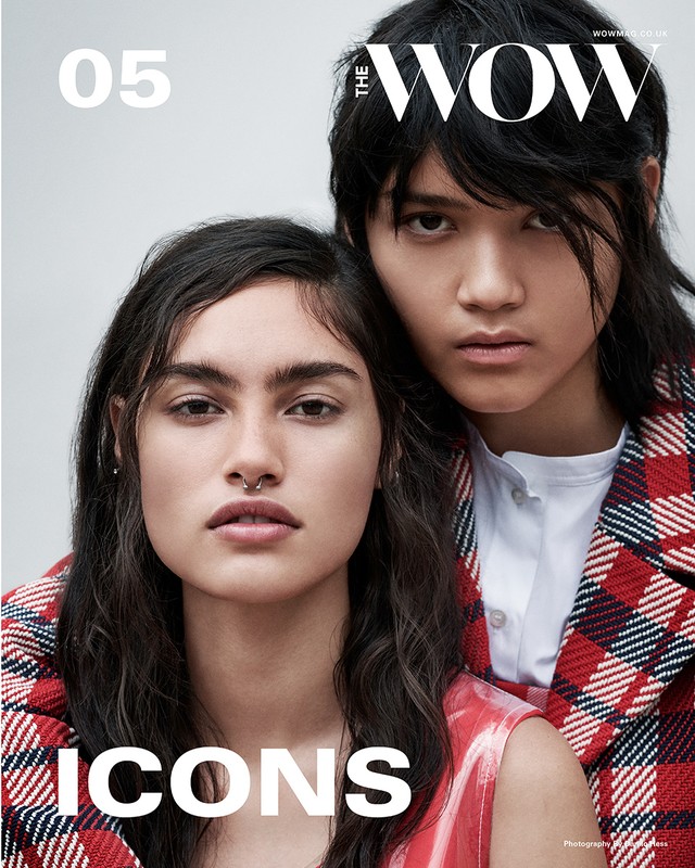 Fashion magazine cover featuring two adult women in a photo studio. One woman has a nose ring, and both wear red and white plaid jackets.