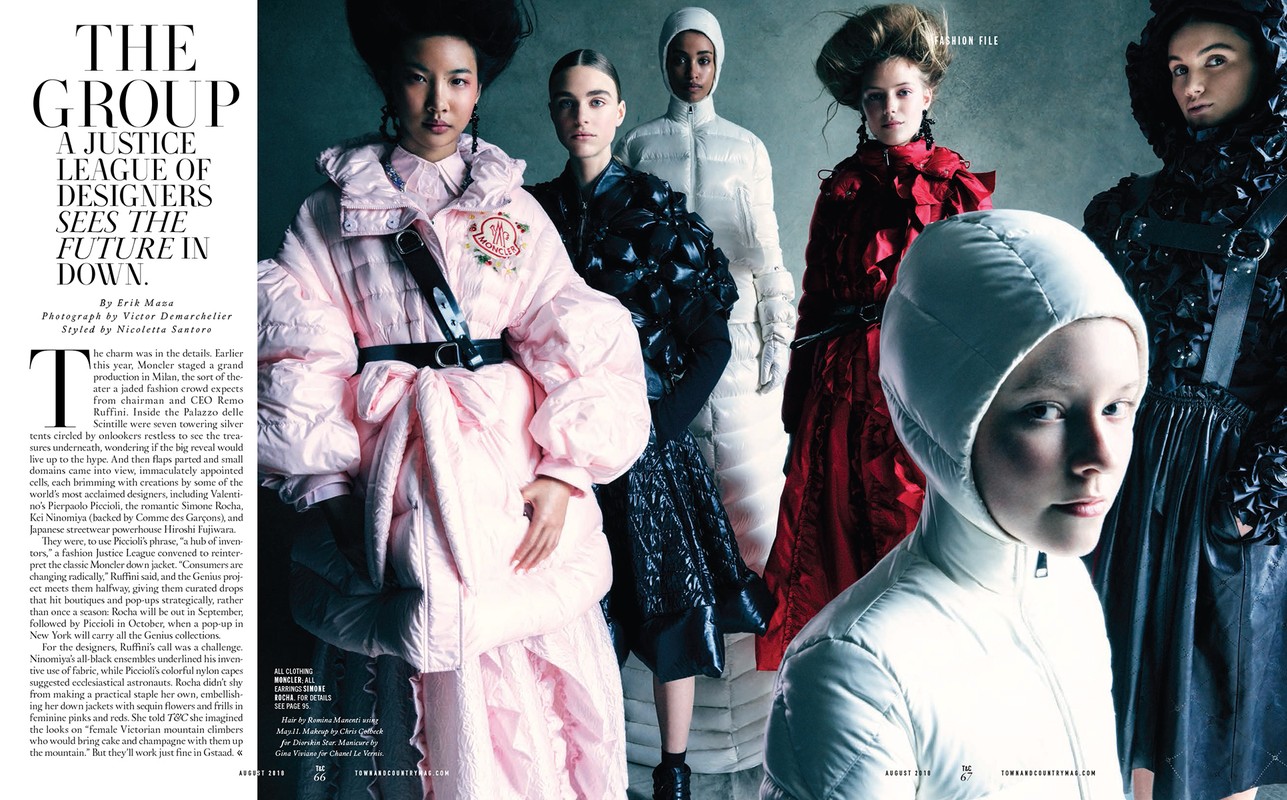 Fashion editorial featuring a group of stylish women in winter apparel against a grey background, showcasing various designs and textures in a studio setting.