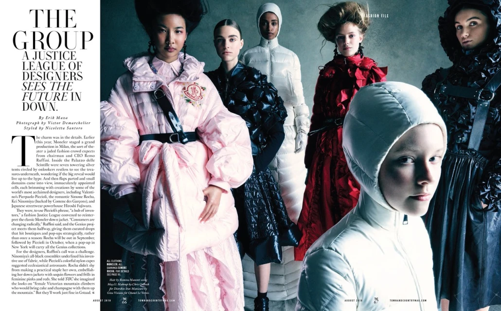 Fashion editorial featuring a group of stylish women in winter apparel against a grey background, showcasing various designs and textures in a studio setting.