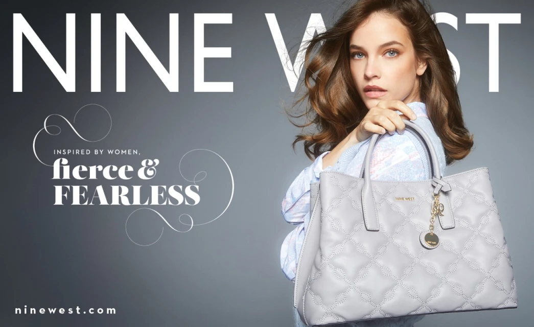 Fashion ad for Nine West handbag features a female model in a studio, holding a light grey quilted leather tote with gold accents.