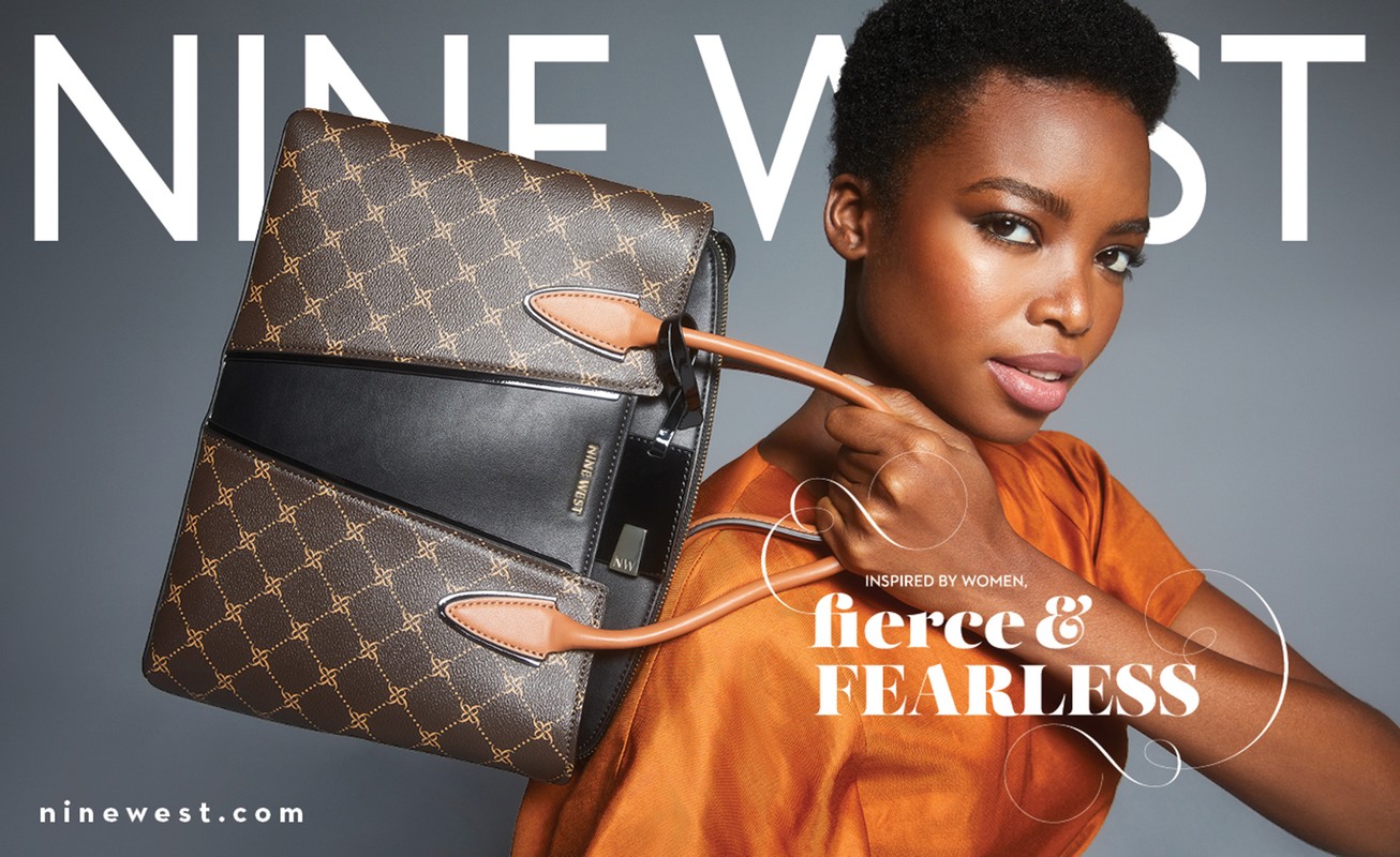 Nine West brand campaign featuring an African American female model carrying a stylish brown leather handbag with gold accents.