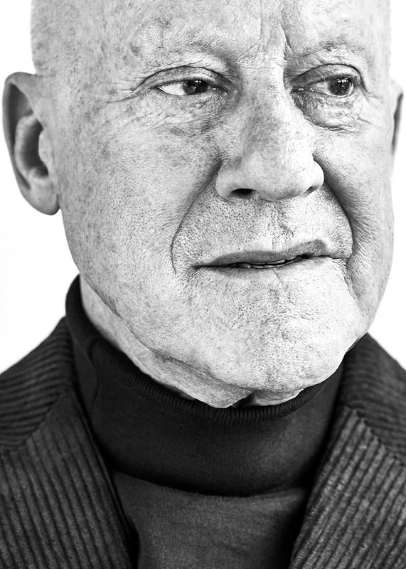 Striking black and white portrait of an elderly man with a thoughtful expression, captured in a close-up shot, showcasing his weathered face.