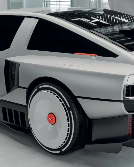Silver Hyundai N Vision 74 concept car showcases its unique silhouette, aerodynamic wheels, and retro-futuristic design elements in detail.