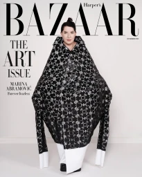 Marina Abramović wearing a sculptural patterned puffer coat on a magazine cover by Christopher Sturman