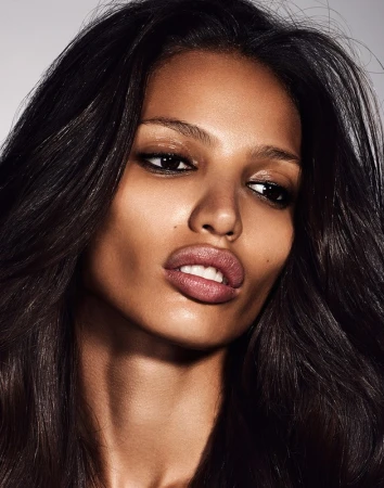 Close-up beauty portrait of a woman with long dark hair and defined makeup by Christopher Ardoff in Los Angeles.
