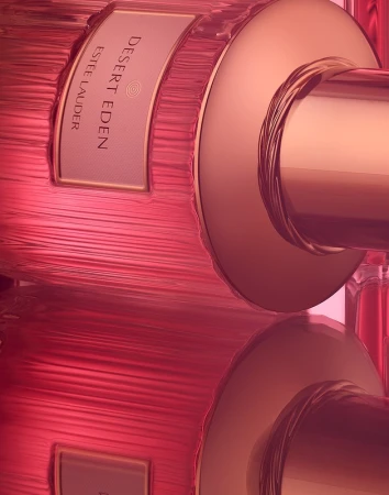 Close-up of a pink perfume bottle with ridged glass and metallic cap photographed by Coppi Barbieri