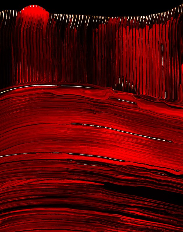 Abstract artwork featuring a vibrant red color palette with striking lines and patterns creating a dynamic visual texture.