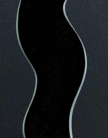 Abstract image of a black, river-like channel with subtle stars running vertically through a dark grey textured surface background.