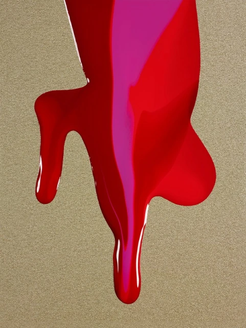 Abstract close-up of dripping red and pink paint on a textured gold surface, creating a vibrant and dynamic visual effect.