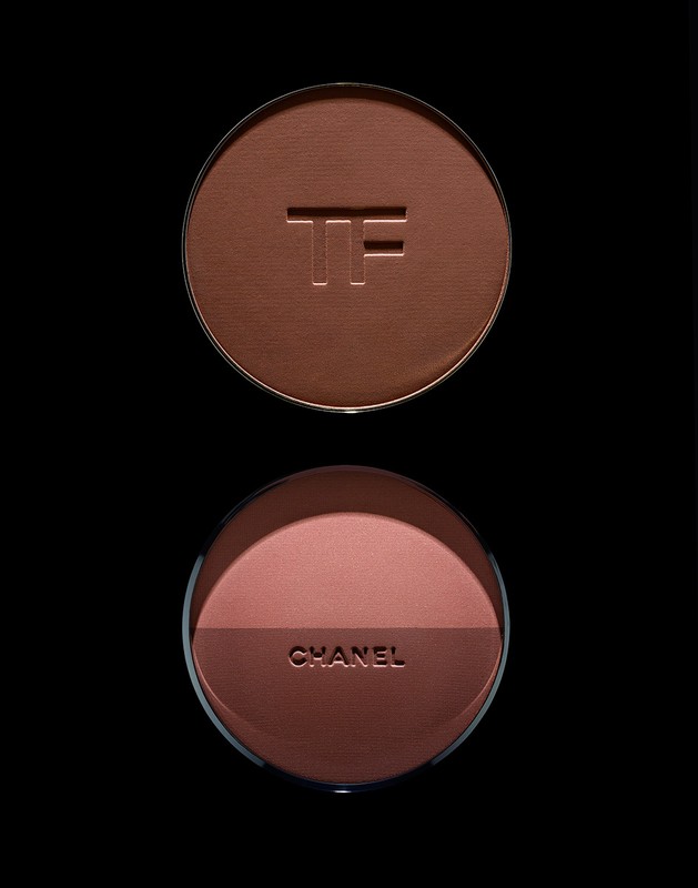 Close-up of two makeup compacts, one from Tom Ford with a bronzer shade and the other from Chanel with blush and bronzer.