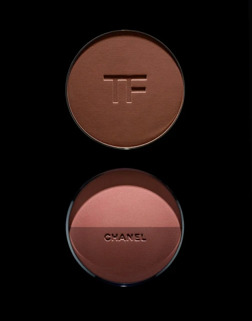 Close-up of two makeup compacts, one from Tom Ford with a bronzer shade and the other from Chanel with blush and bronzer.