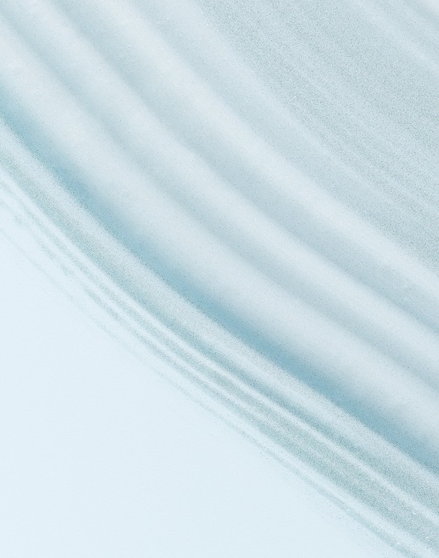 Abstract background featuring rippled light blue and white fabric. The texture and patterns create a visually soothing effect.