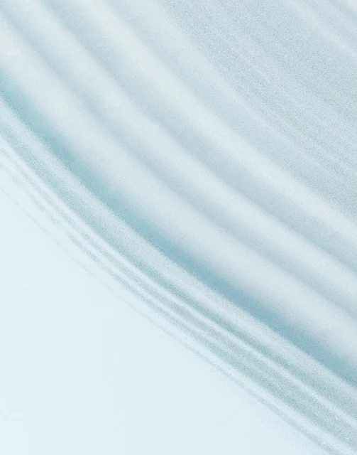 Abstract background featuring rippled light blue and white fabric. The texture and patterns create a visually soothing effect.