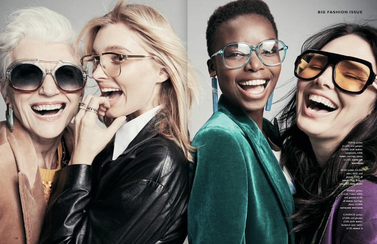 Four smiling women of diverse ages and ethnicities are shown in a brightly lit fashion layout with stylish glasses and colorful clothing.