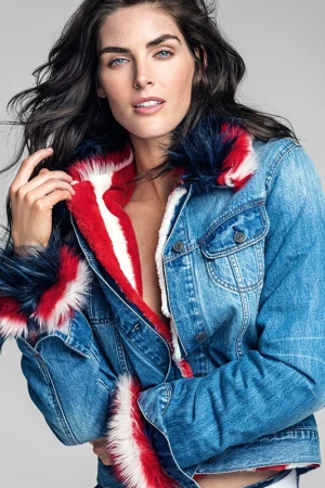 Close-up portrait of a female model wearing a denim jacket with faux fur trim by make-up artist Cynthia Sobek.