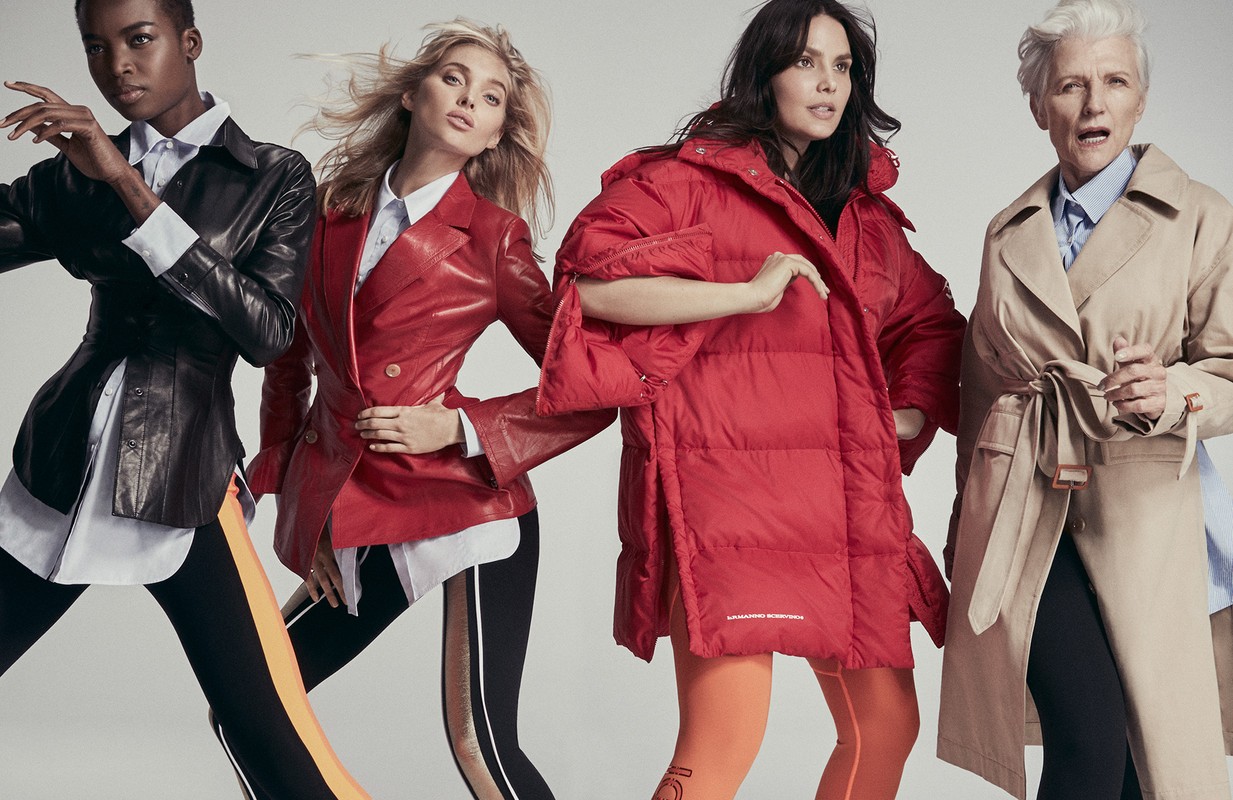 Four fashion models in vibrant jackets and leggings strike poses in a studio setting, showcasing diverse styles and contemporary designs.